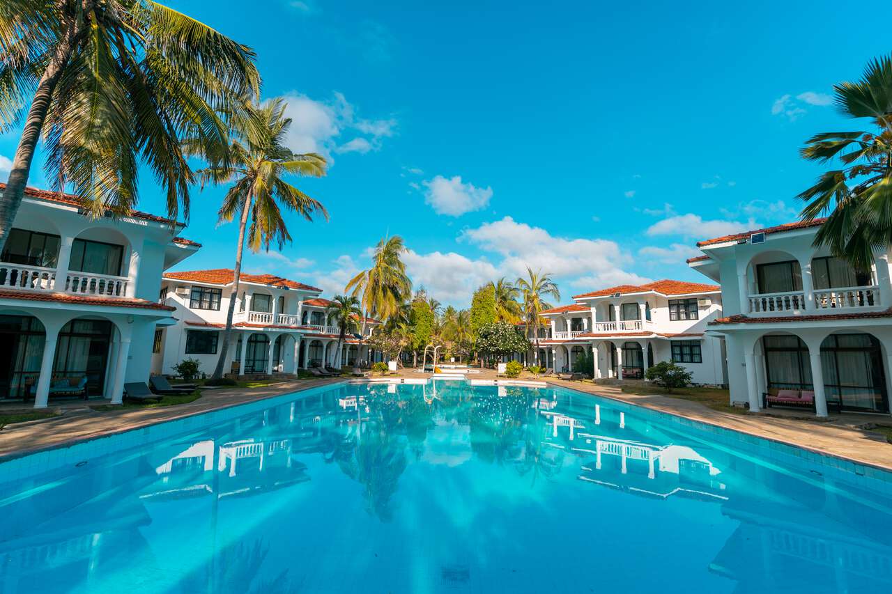 Beachfront resort villas and pool at Diani Beach, Mombasa