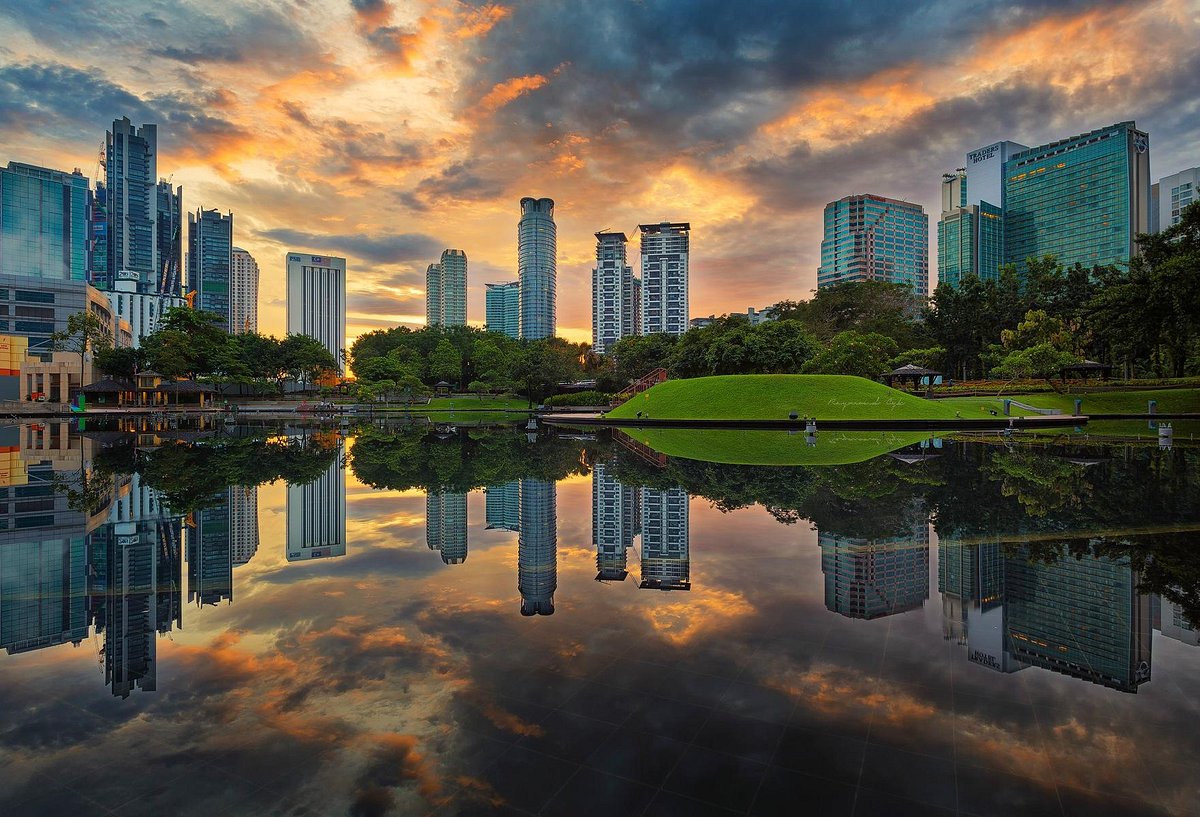 KLCC Park with the city skyline reflected at sunset