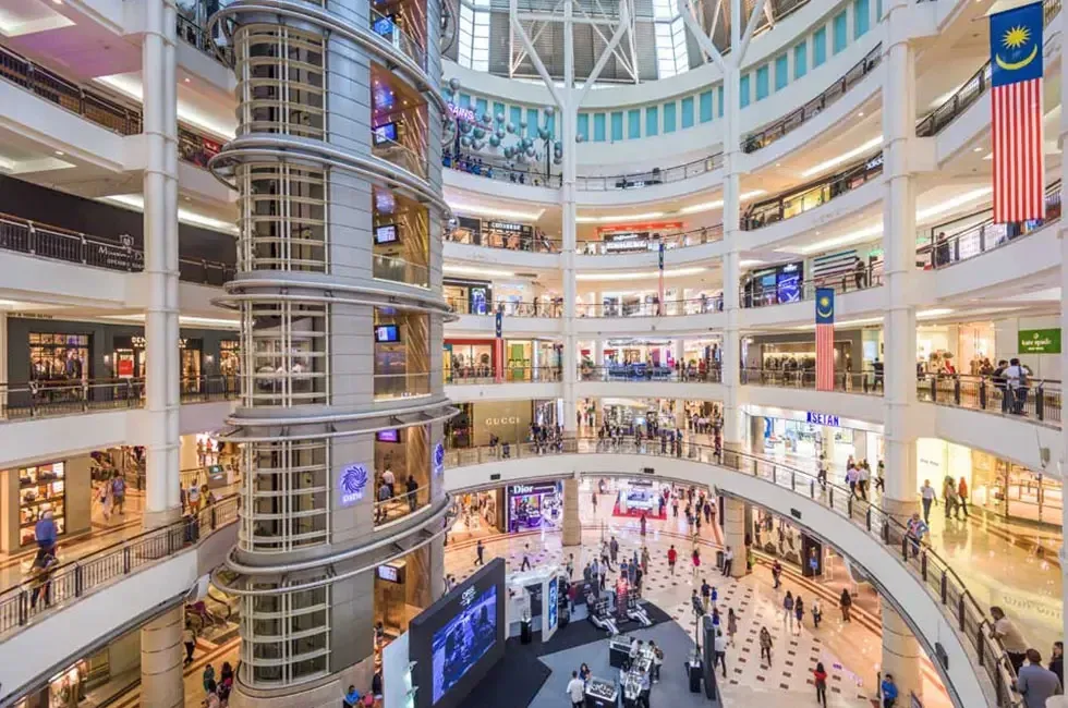 The soaring multi-level atrium inside Suria KLCC mall