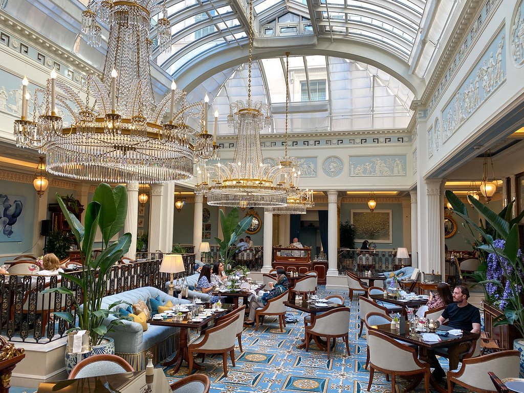 The glass-roofed tea room at The Lanesborough set for afternoon tea