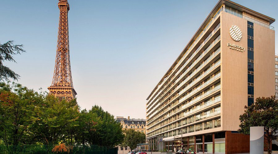 Pullman Paris Tour Eiffel hotel with the Eiffel Tower visible behind it