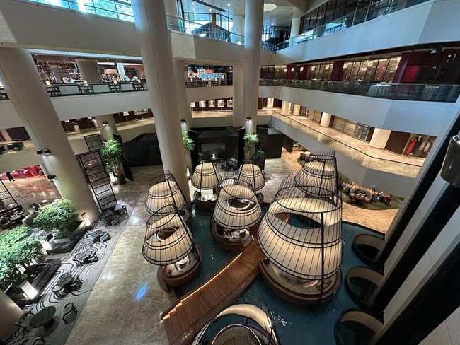 The soaring atrium lobby of Pan Pacific Singapore